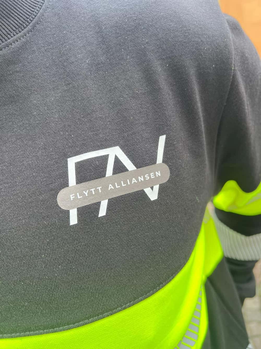 Flyttmeter logotyp på kläder